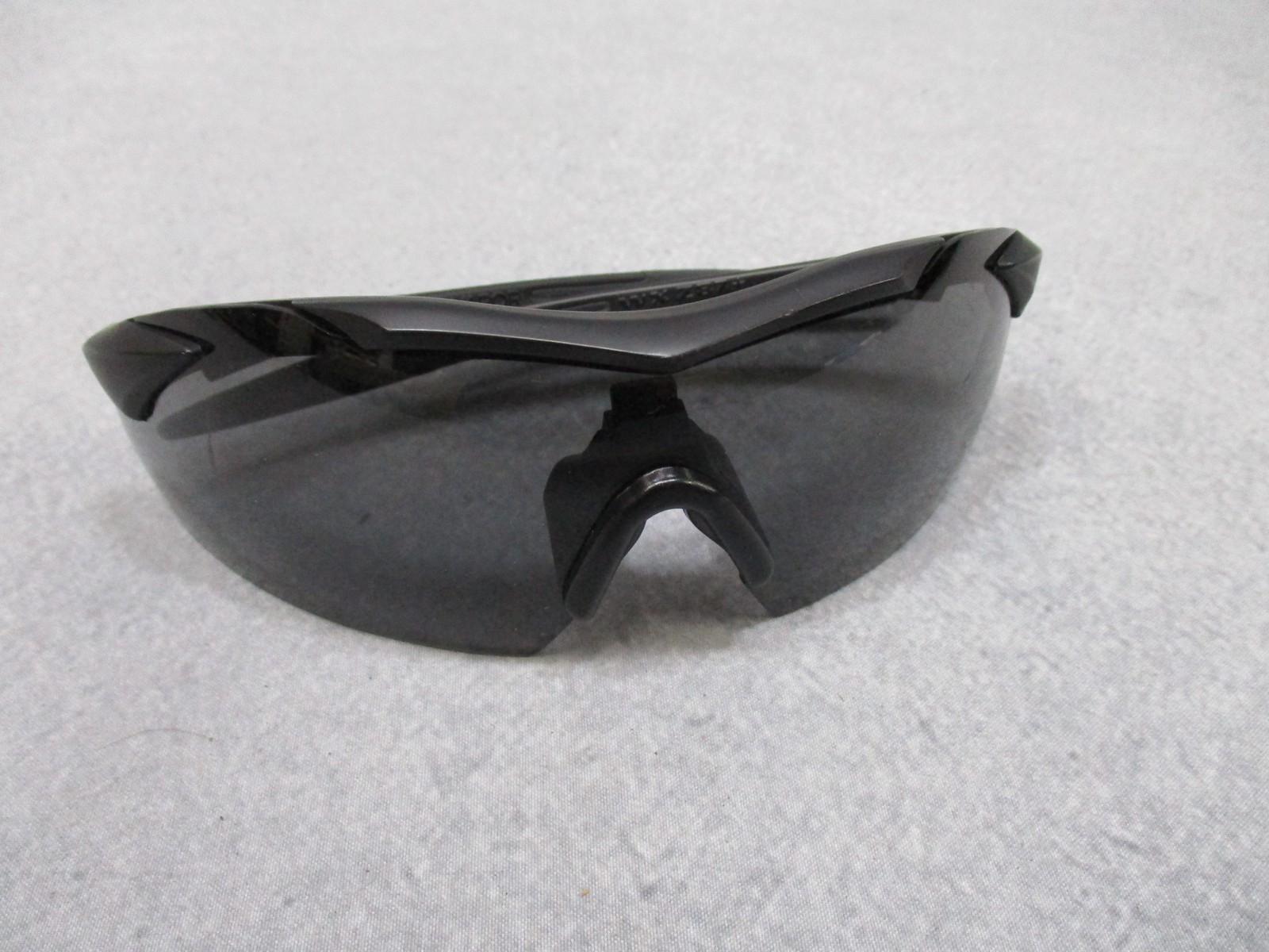 Used Wiley X Vapor sunglasses with interchangeable lenses and case, featuring durable frame and sporty style for outdoor protection.