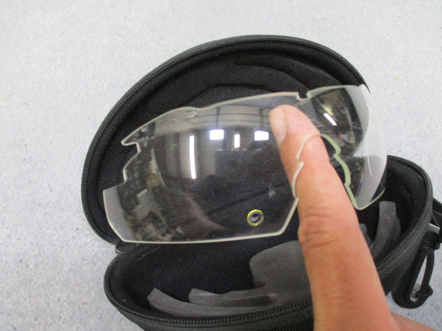 Wiley X Vapor sunglasses with interchangeable lenses and case, featuring a black frame and clear lenses for versatile eye protection.