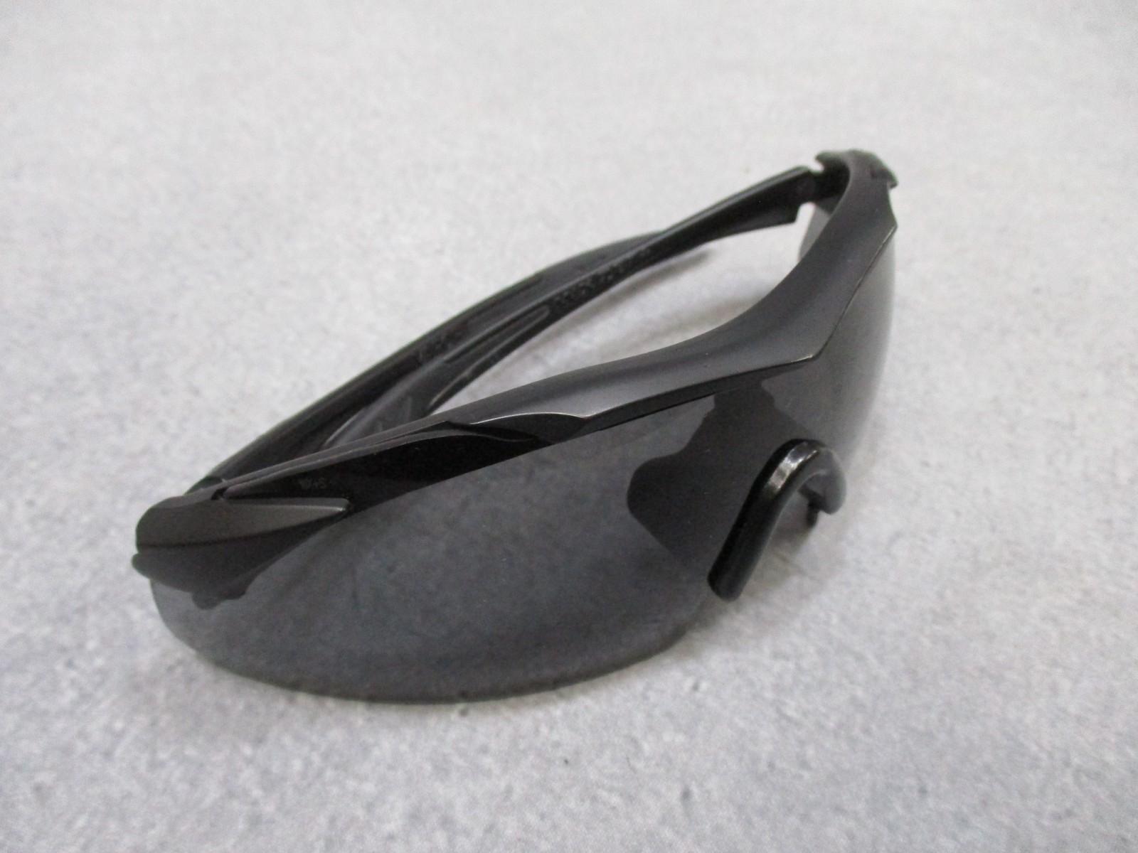 Wiley X Vapor sunglasses with interchangeable lenses and case, featuring a sleek design and durable frame, used condition.