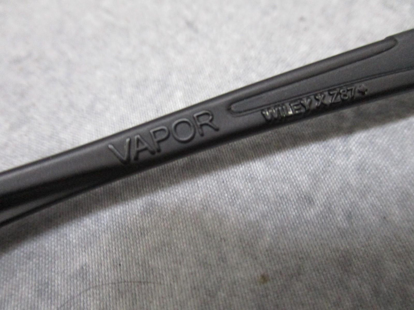 Wiley X Vapor sunglasses with interchangeable lenses, black frame, and case, used, featuring Z87+ impact protection.