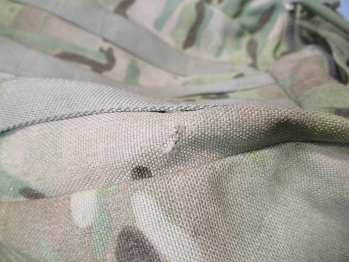MOLLE 4000 Airborne Test Item rucksack in camo with cracked frame and worn condition