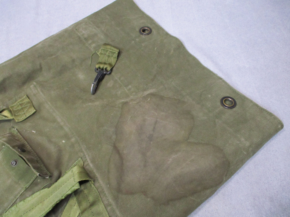 USGI 1980s OD green cotton canvas duffel sea bag, military surplus used, with sturdy handles and vintage design.
