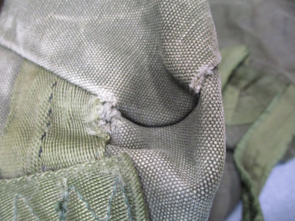 USGI 1980s OD green cotton canvas duffel sea bag, military surplus, used condition with sturdy handles and vintage design.