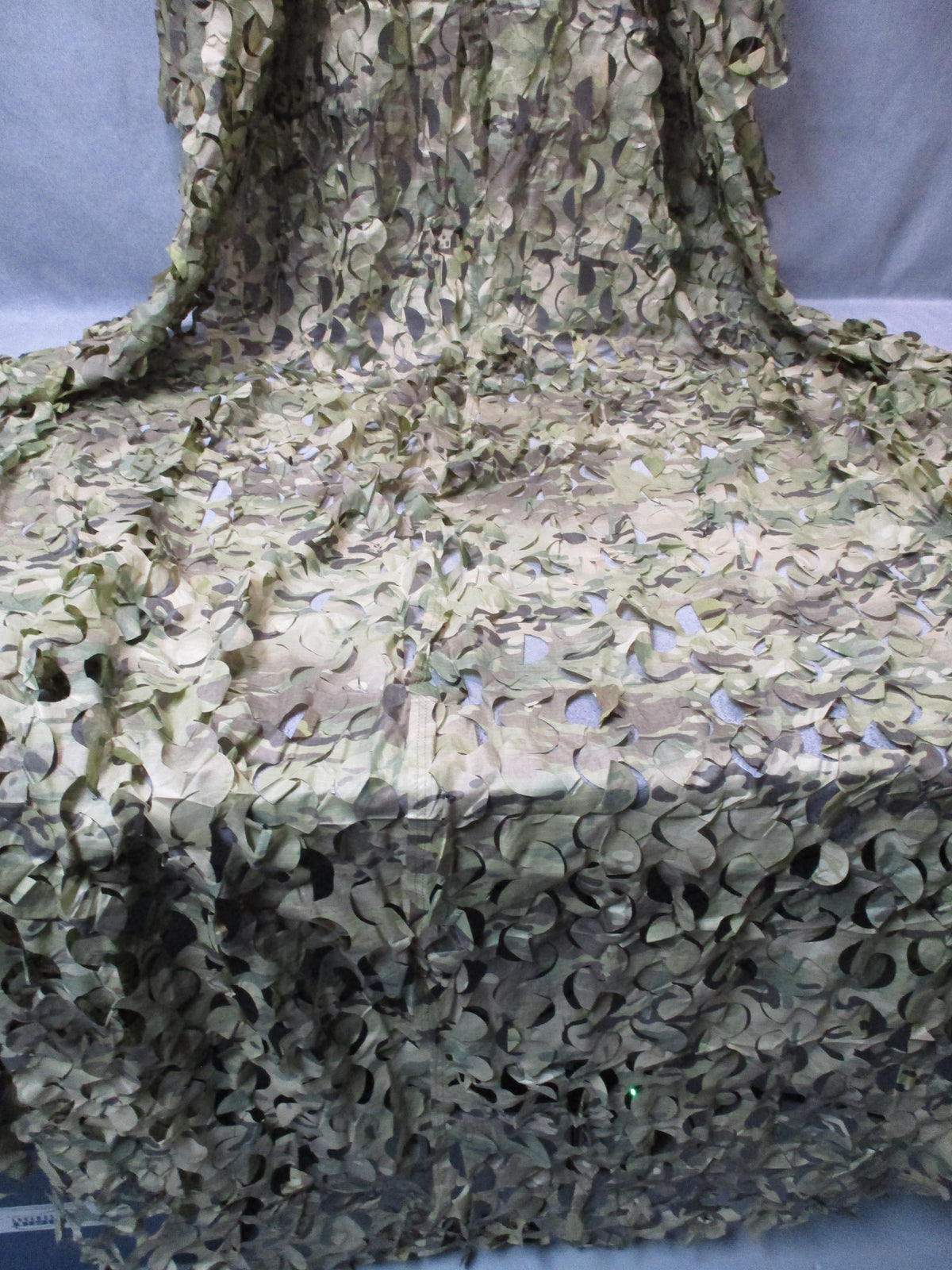 Unbranded leaf-cut camouflage netting, approximately 10 x 7 ft.