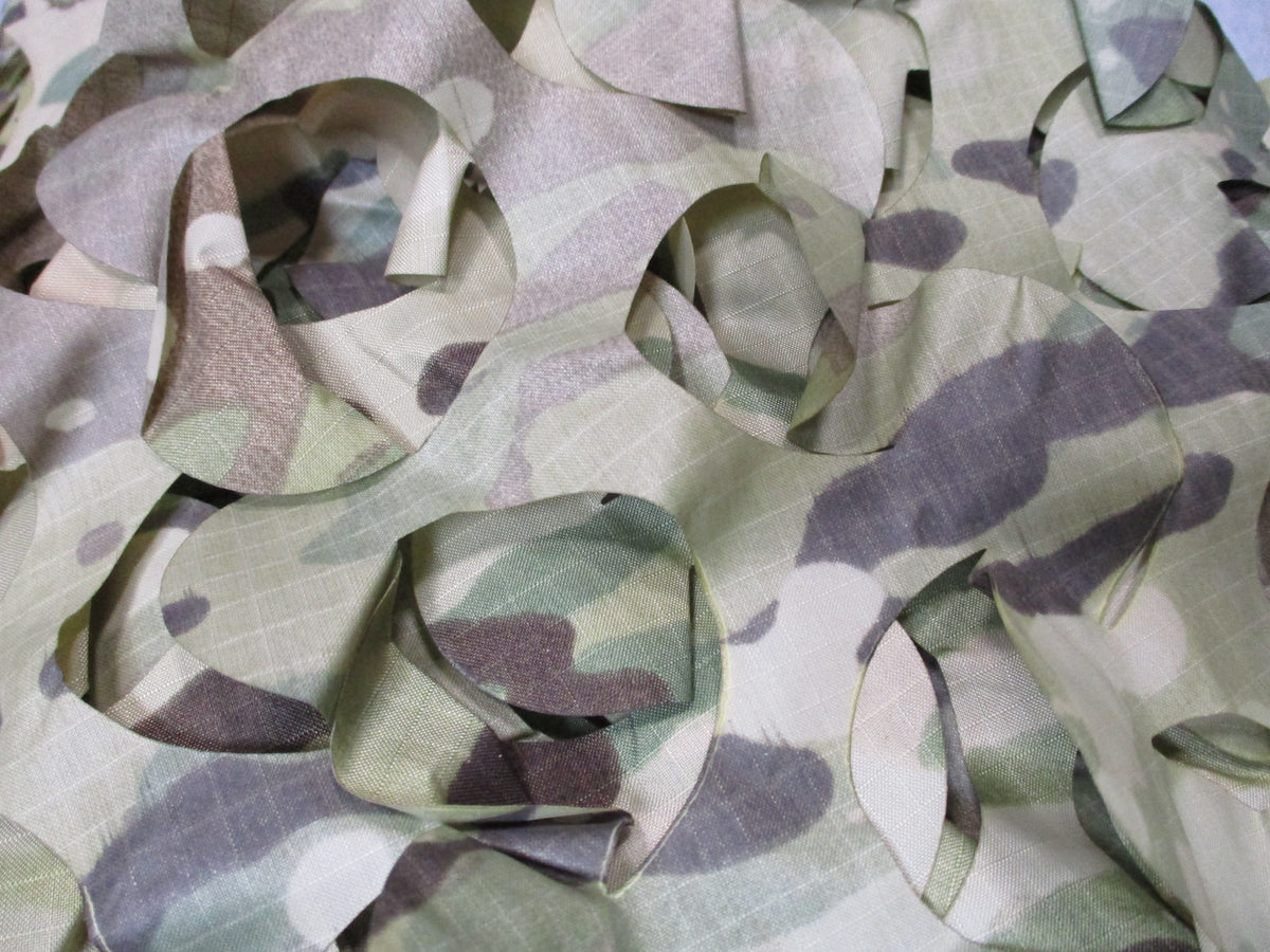 Camouflage netting leaf-cut ripstop hunting blind cover, approximately 10x7 feet, unbranded