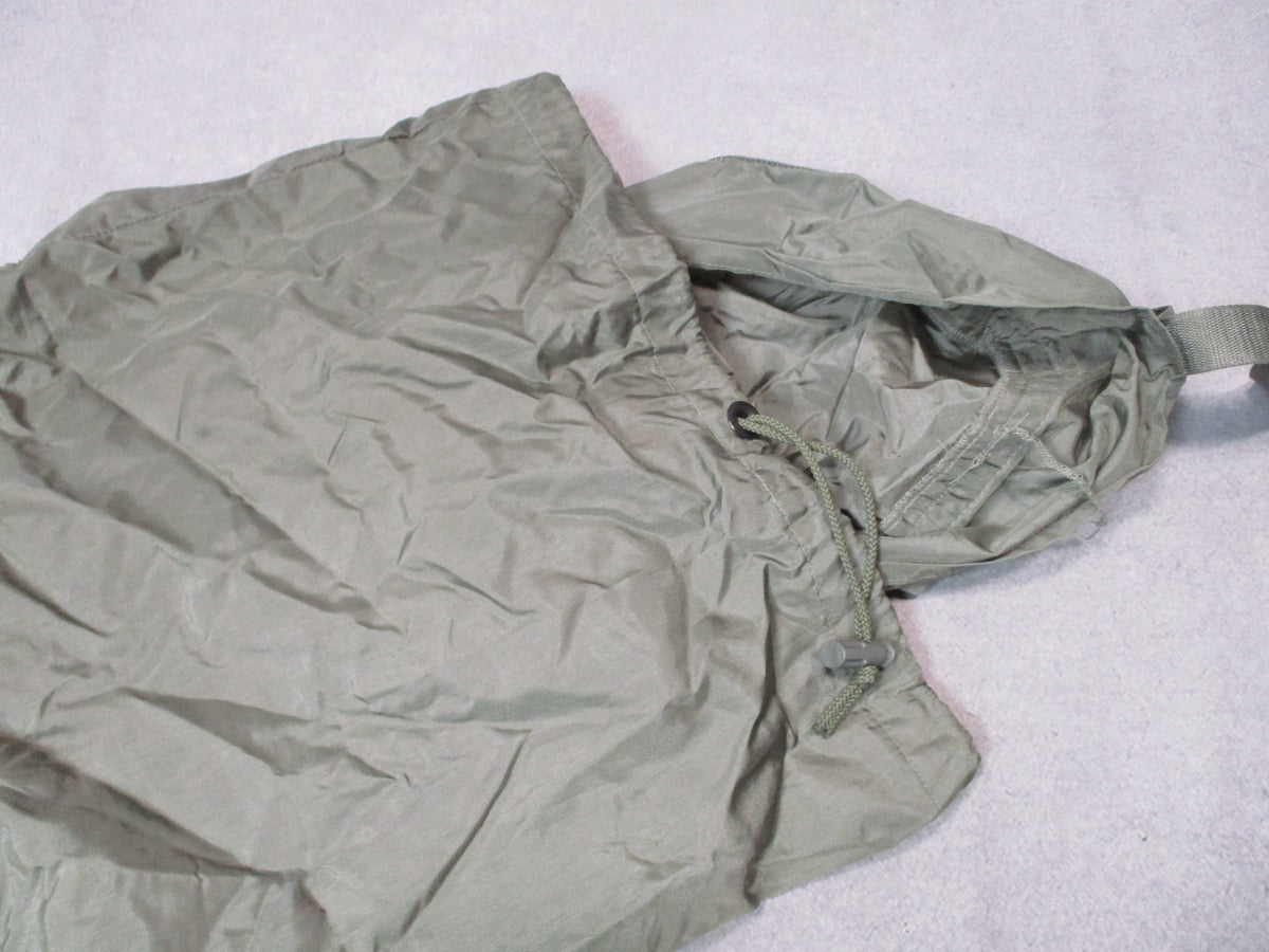 USGI US Army small compression stuff sack in urban gray, compact military gear bag shown flat with drawstring closure