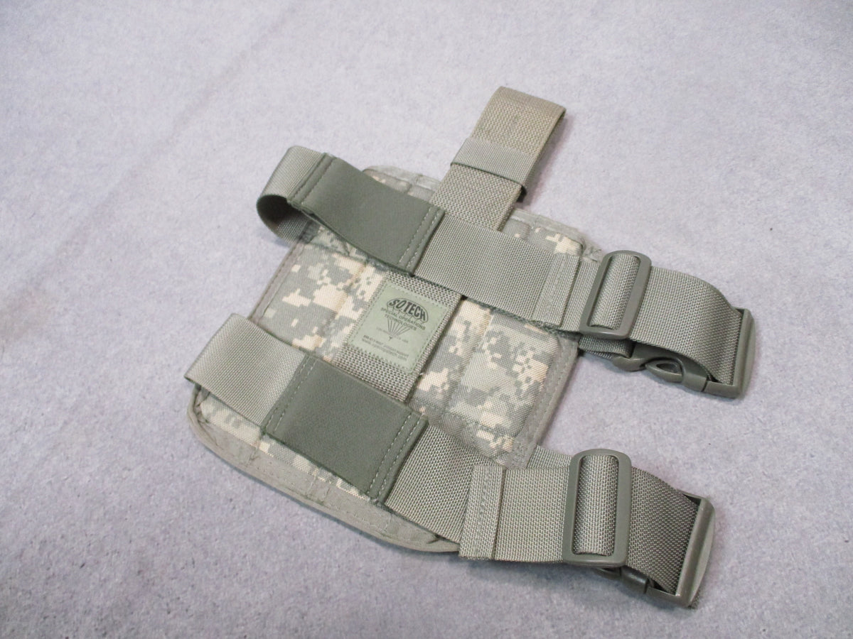 S.O.TECH ACU UCP MOLLE tactical leg platform with adjustable straps and MOLLE attachment points for military or tactical gear.
