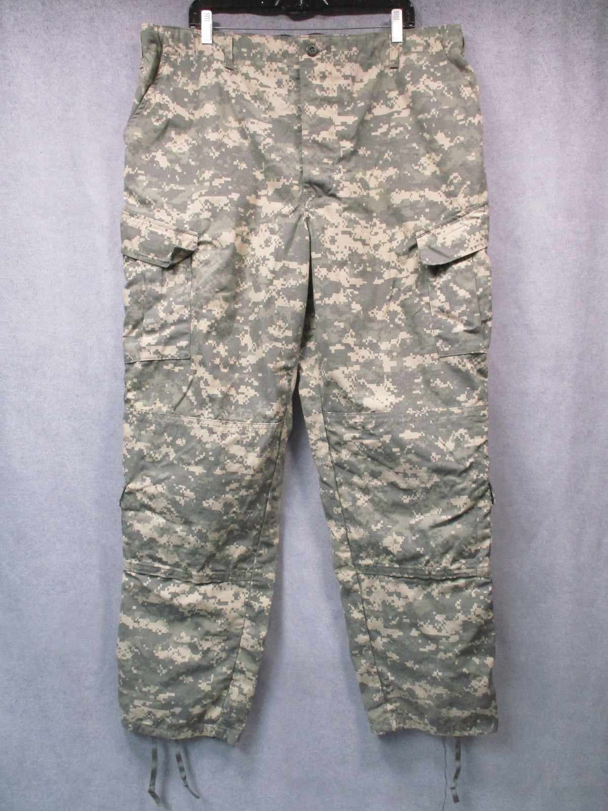 U.S. Army ACU UCP military combat trousers in XL long size, featuring cargo pockets and durable fabric for tactical use.