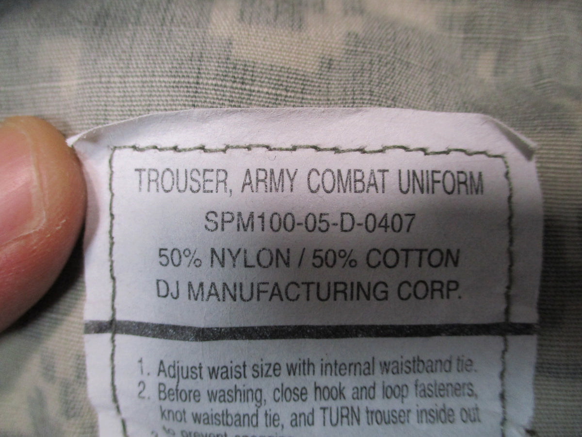U.S. Army ACU UCP military combat trousers in XL long size, featuring durable fabric, multiple pockets, and tactical design.