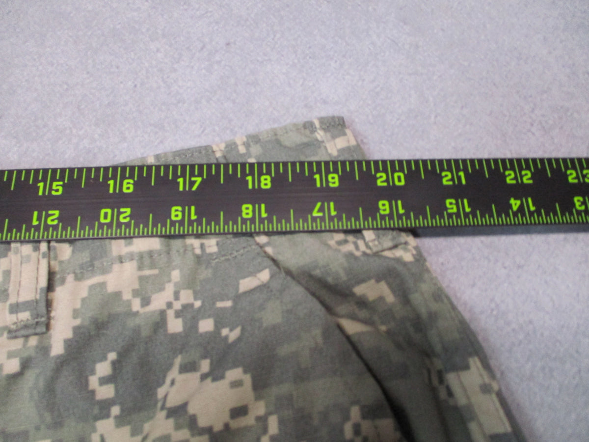 U.S. Army ACU UCP military combat trousers in XL long size, featuring camouflage pattern, multiple pockets, and durable fabric.
