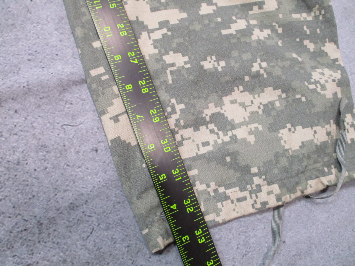U.S. Army ACU UCP combat trousers in XL long size, with camouflage pattern, multiple pockets, and reinforced knees.