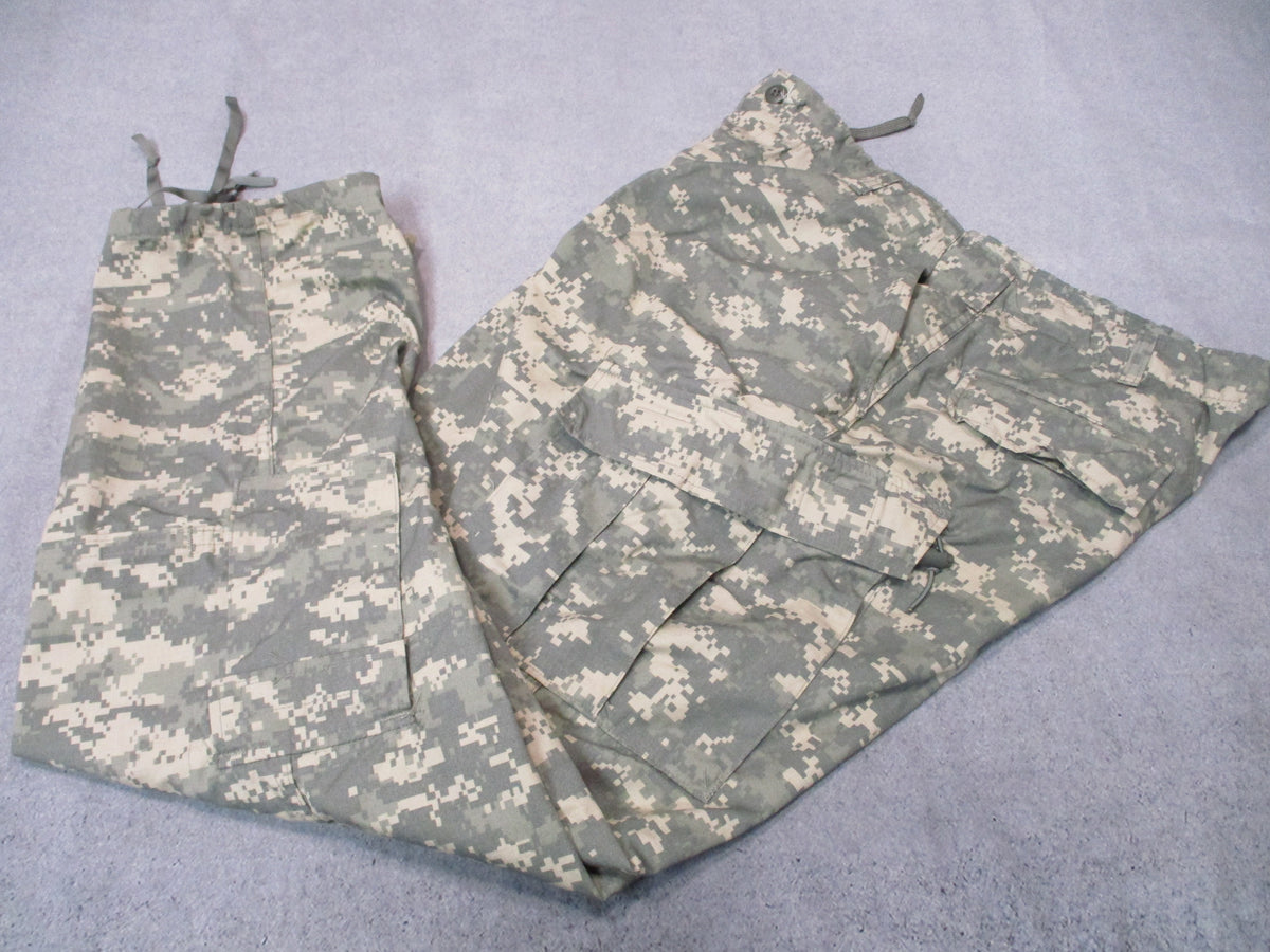 U.S. Army ACU UCP military combat trousers in XL long, featuring rugged fabric and tactical design with multiple pockets.