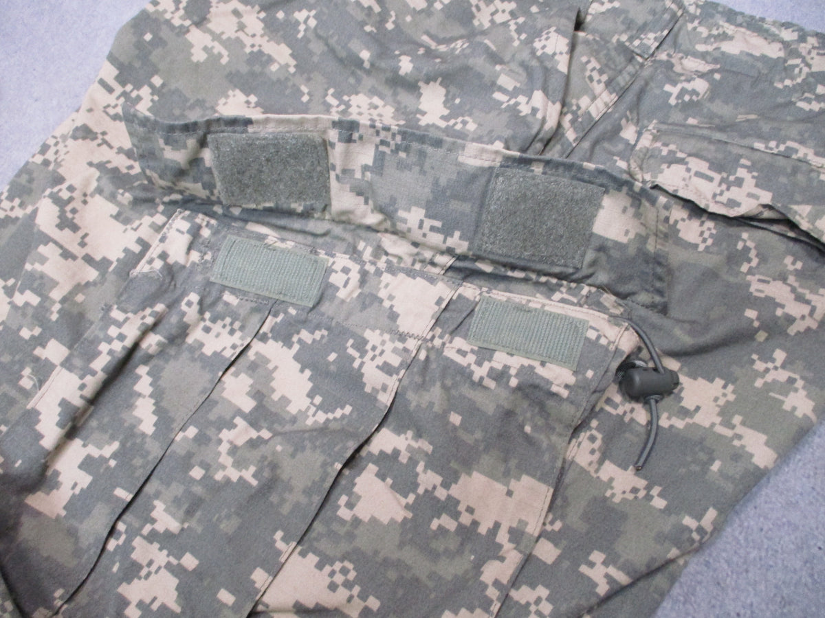 U.S. Army ACU UCP military combat trousers in size XL long, featuring multiple pockets and durable fabric for tactical use.
