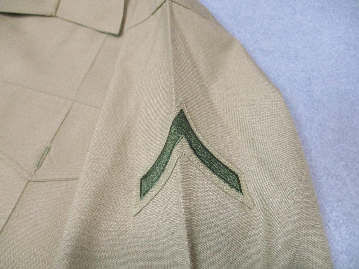 Genuine USMC Woolrich Valor Collection khaki dress shirt, short sleeve, size 16.5, with military-style collar and button front.