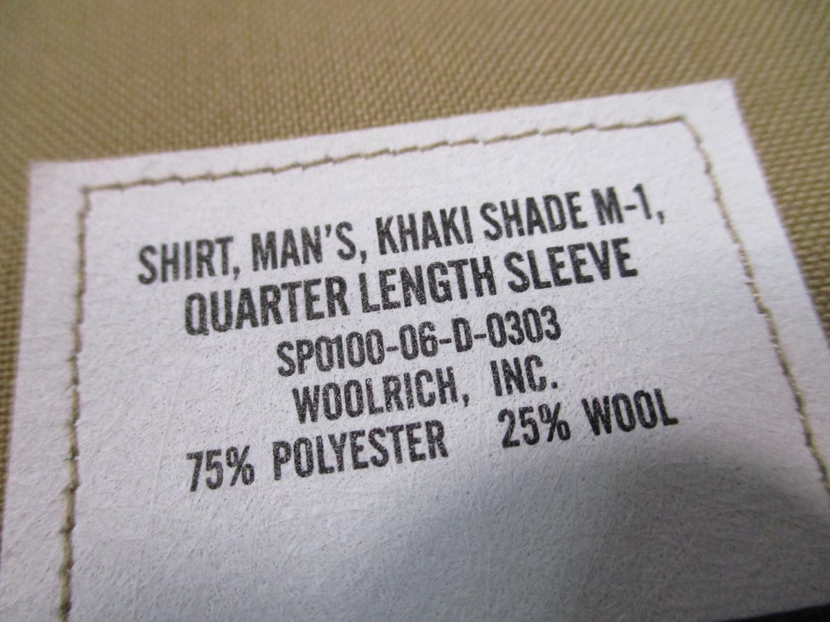 Genuine USMC Woolrich Valor khaki dress shirt, short sleeve, size 16.5, with collar and button front, part of Valor Collection.