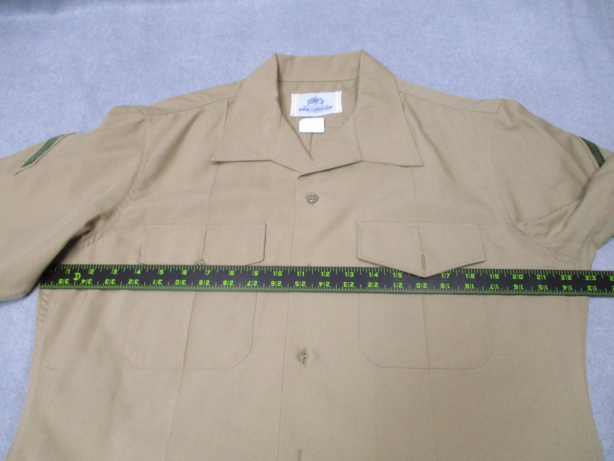 Genuine USMC Woolrich Valor Collection khaki dress shirt, short sleeve, size 16.5, featuring a collar and button front.