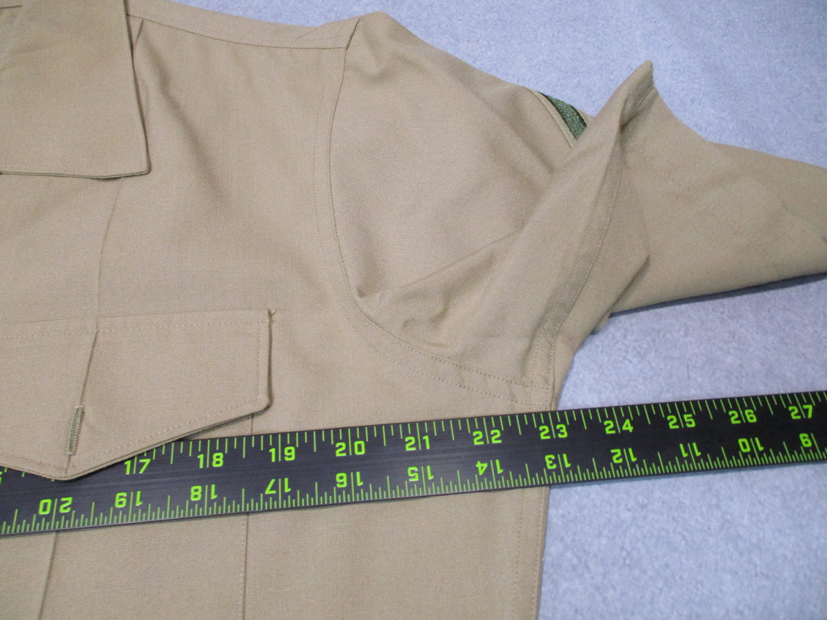 Genuine USMC Woolrich Valor khaki dress shirt, short sleeve, size 16.5, featuring a classic military style with button front.
