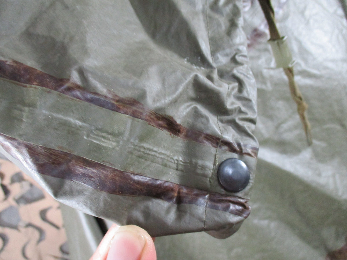 Bundeswehr German military OD green rain poncho with hood, used military rain cape for shelter and protection.
