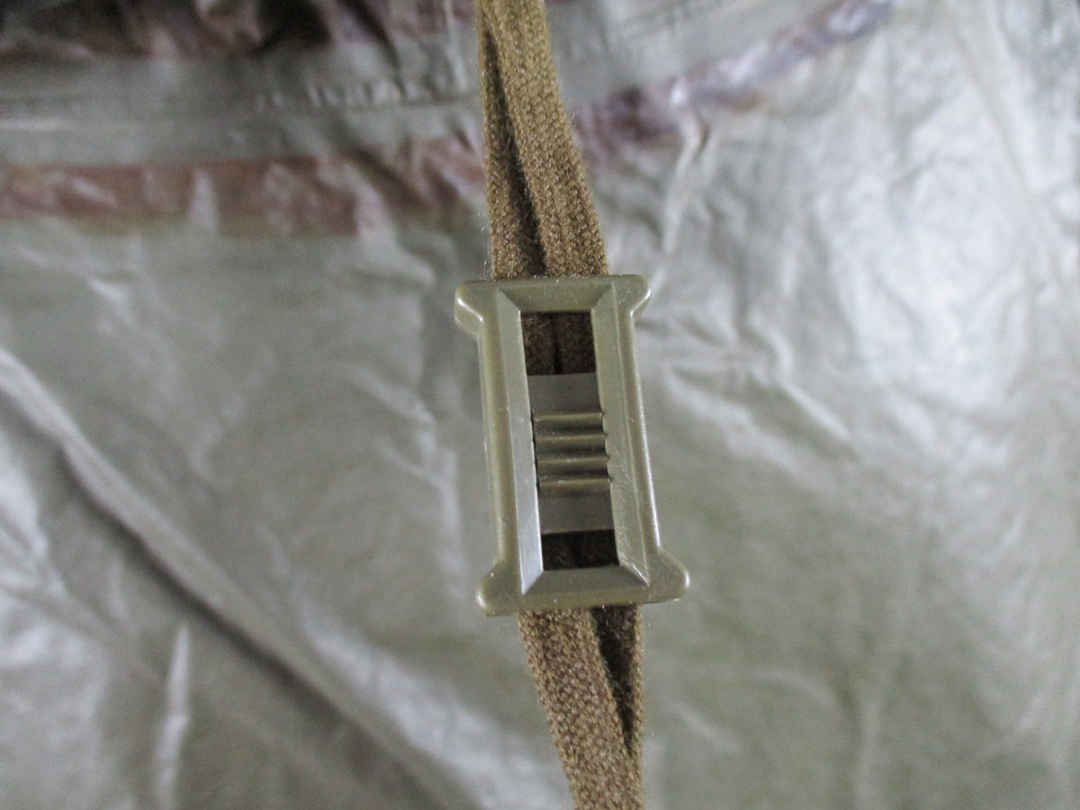 German Bundeswehr military poncho in OD green, used rain cape with shelter features, suitable for outdoor protection.