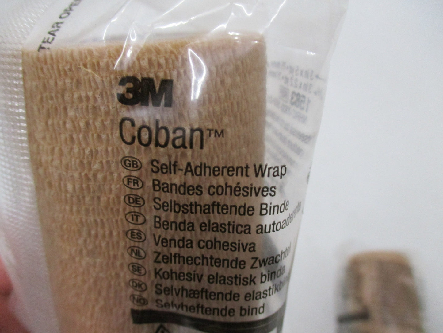 3M Coban self-adherent wrap in tan, 3 inches wide, 5 yards long, displayed in a pack of two rolls.