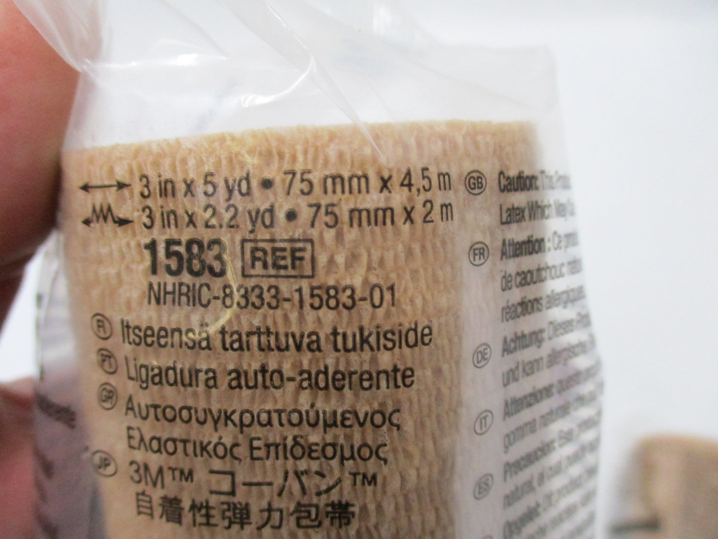 3M Coban self-adherent wrap in tan, 3 inches wide by 5 yards long, displayed in a two-pack for versatile use.