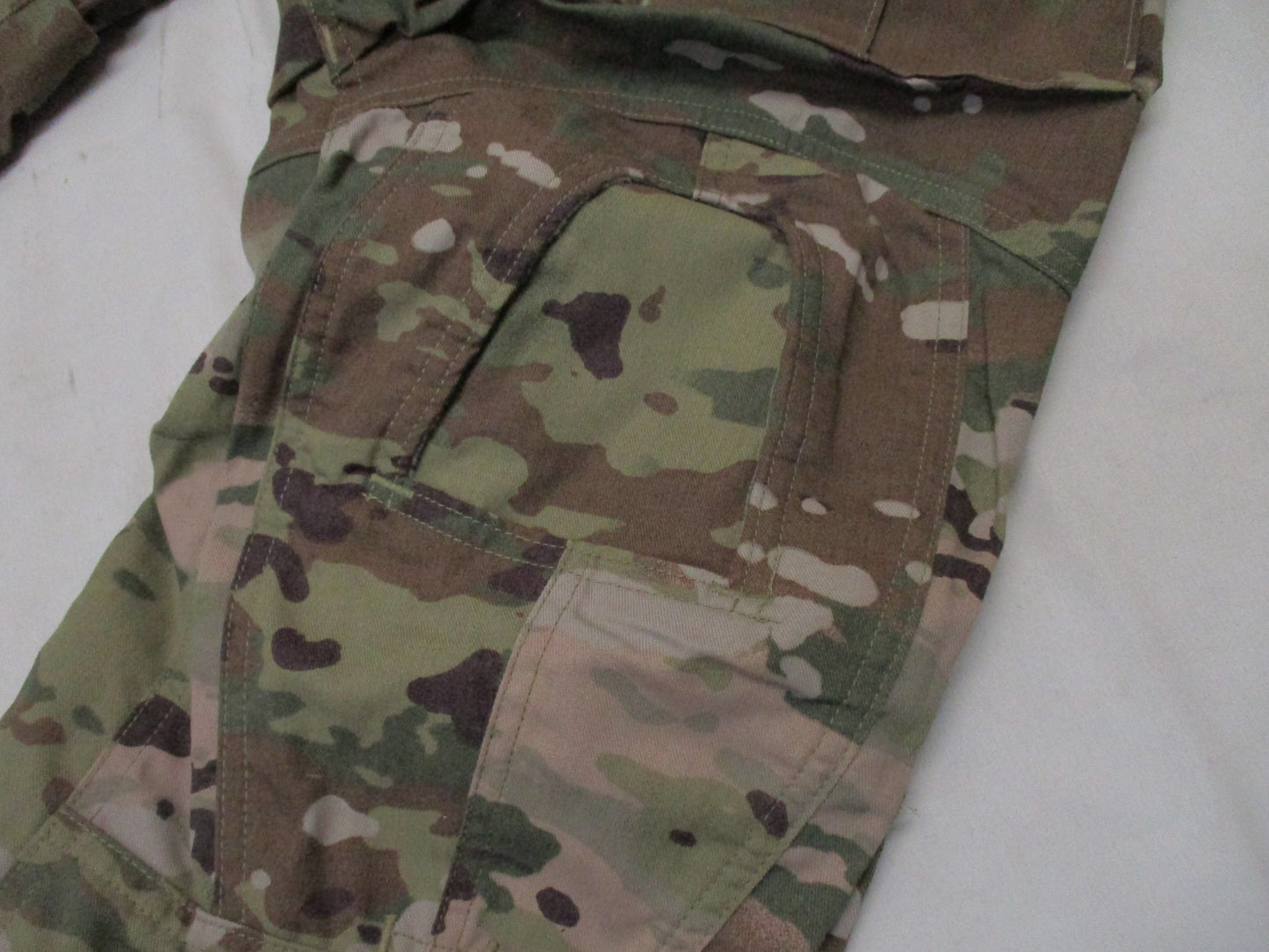 Army combat pants in Scorpion OCP camouflage with Crye knee pad compatibility, medium/short size, worn by a soldier.