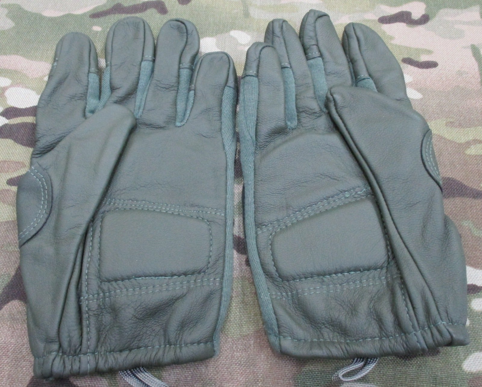 Sage green US Army combat gloves, cut/fire resistant, size X-Large, by Hatch HWI, featuring durable fabric and reinforced stitching.