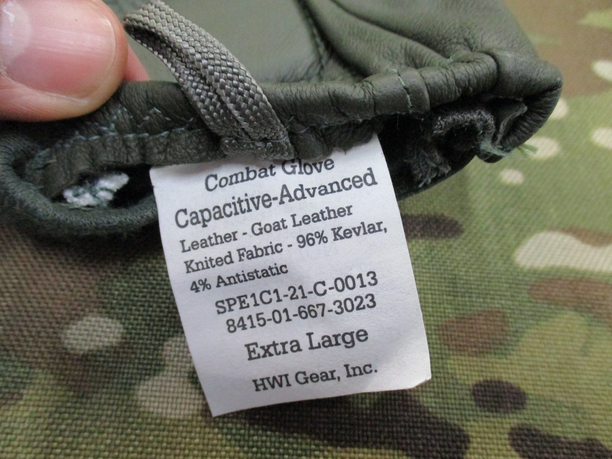 X-Large sage green US Army combat gloves, cut/fire resistant, by Hatch HWI, displayed on a neutral background.