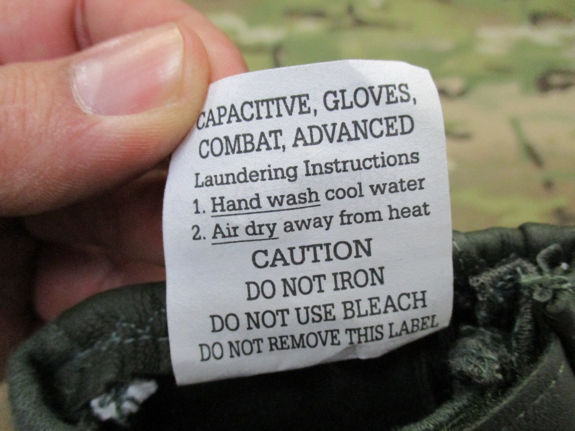 X-large sage green US Army combat gloves, cut and fire resistant, by Hatch HWI, displayed on a neutral background.