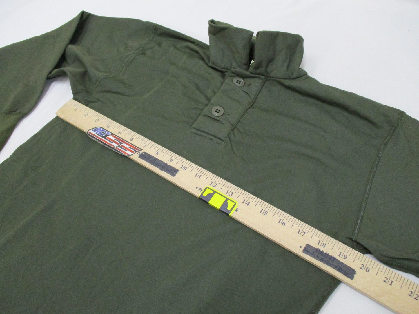 Olive drab Vietnam 1969 USGI tricot knit shirt for men, small size, vintage military style, worn fabric with sleeping man design.
