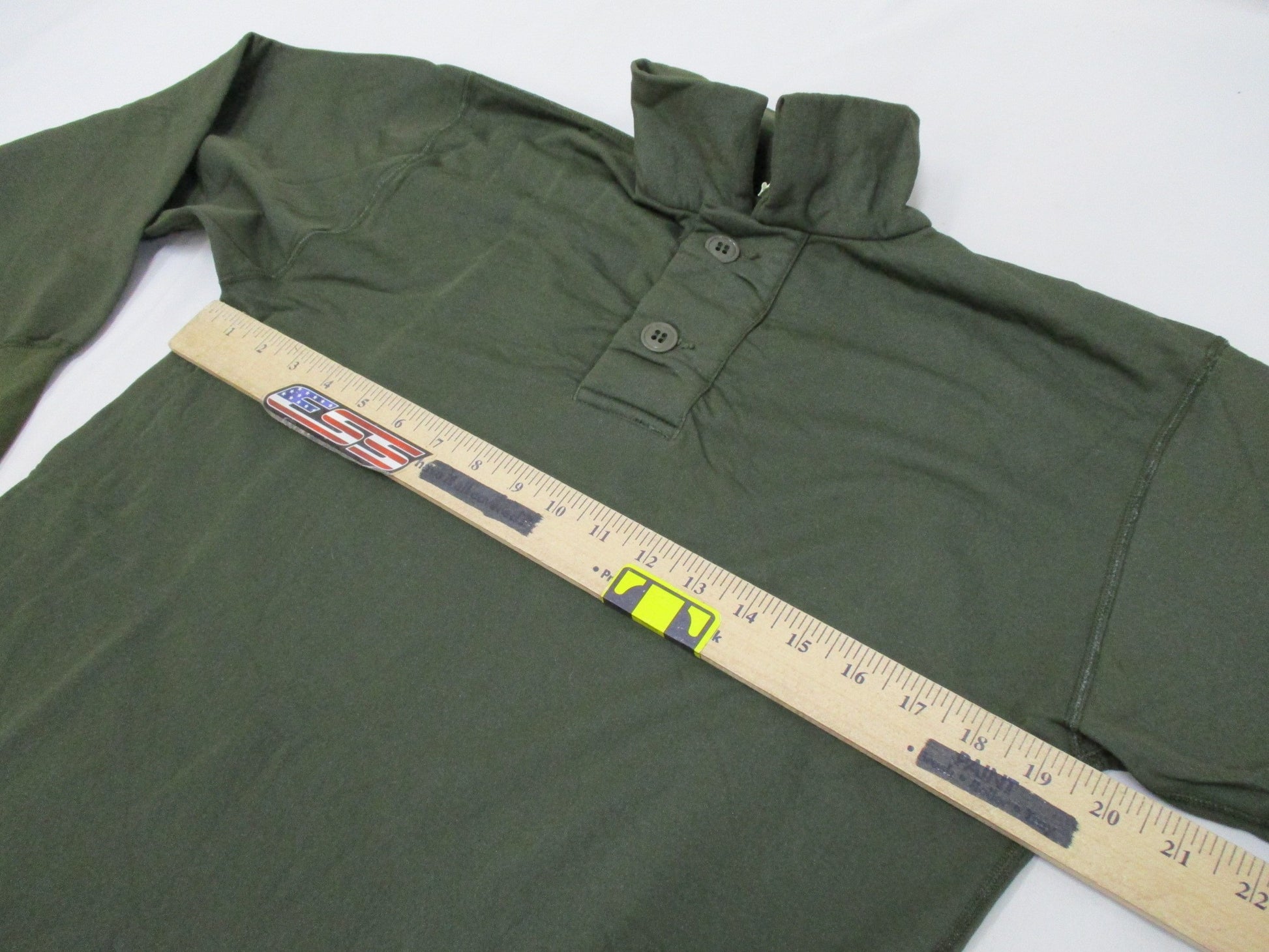 Olive drab Vietnam 1969 USGI tricot knit shirt for men, small size, vintage military style, worn fabric with sleeping man design.