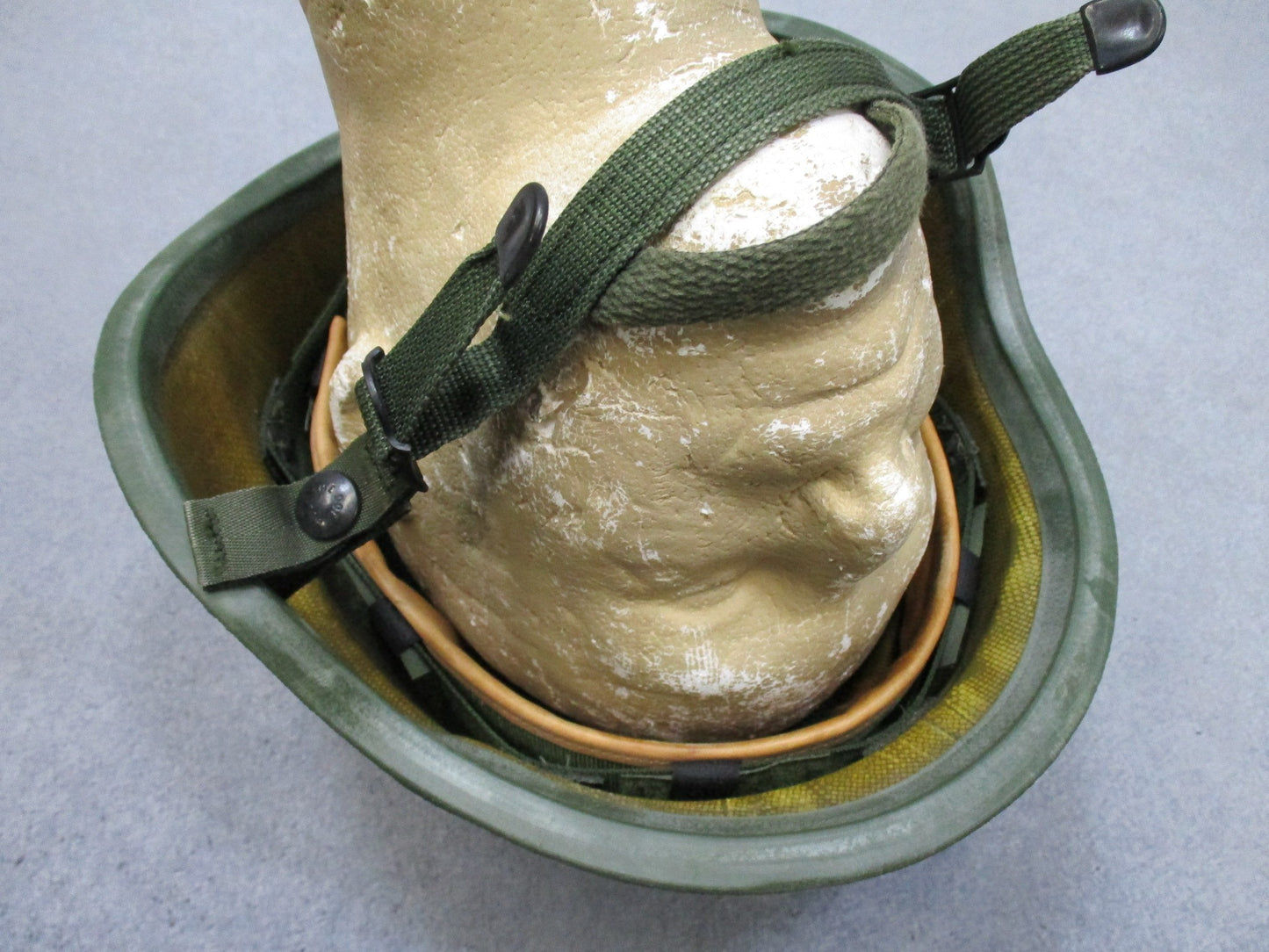 Centex Military Gear large PASGT Kevlar helmet K-POT with adjustable straps and a matte finish, shown from the side.