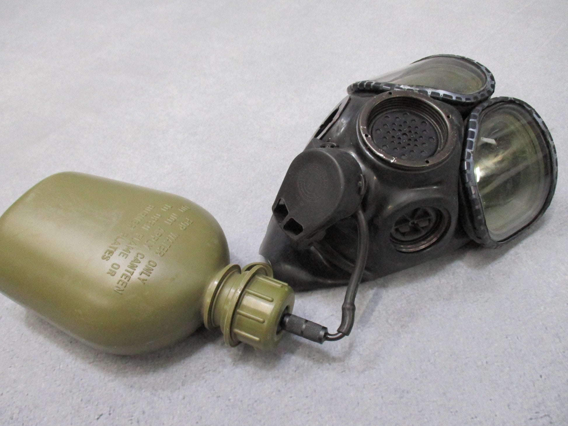 M40 MCU-2A/P gas mask external drinking tube by Centex Military Gear against a neutral background.