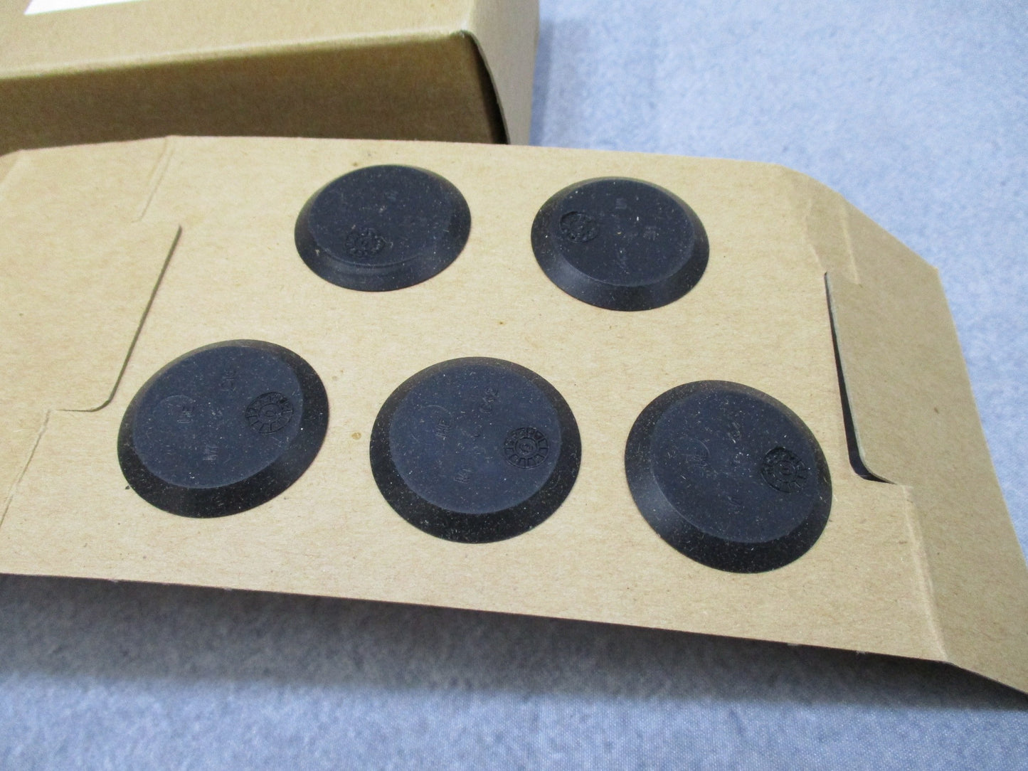 Centex Military Gear USGI M40 gas mask outlet valve disks in a 10 pack, showing the disks' design and features.
