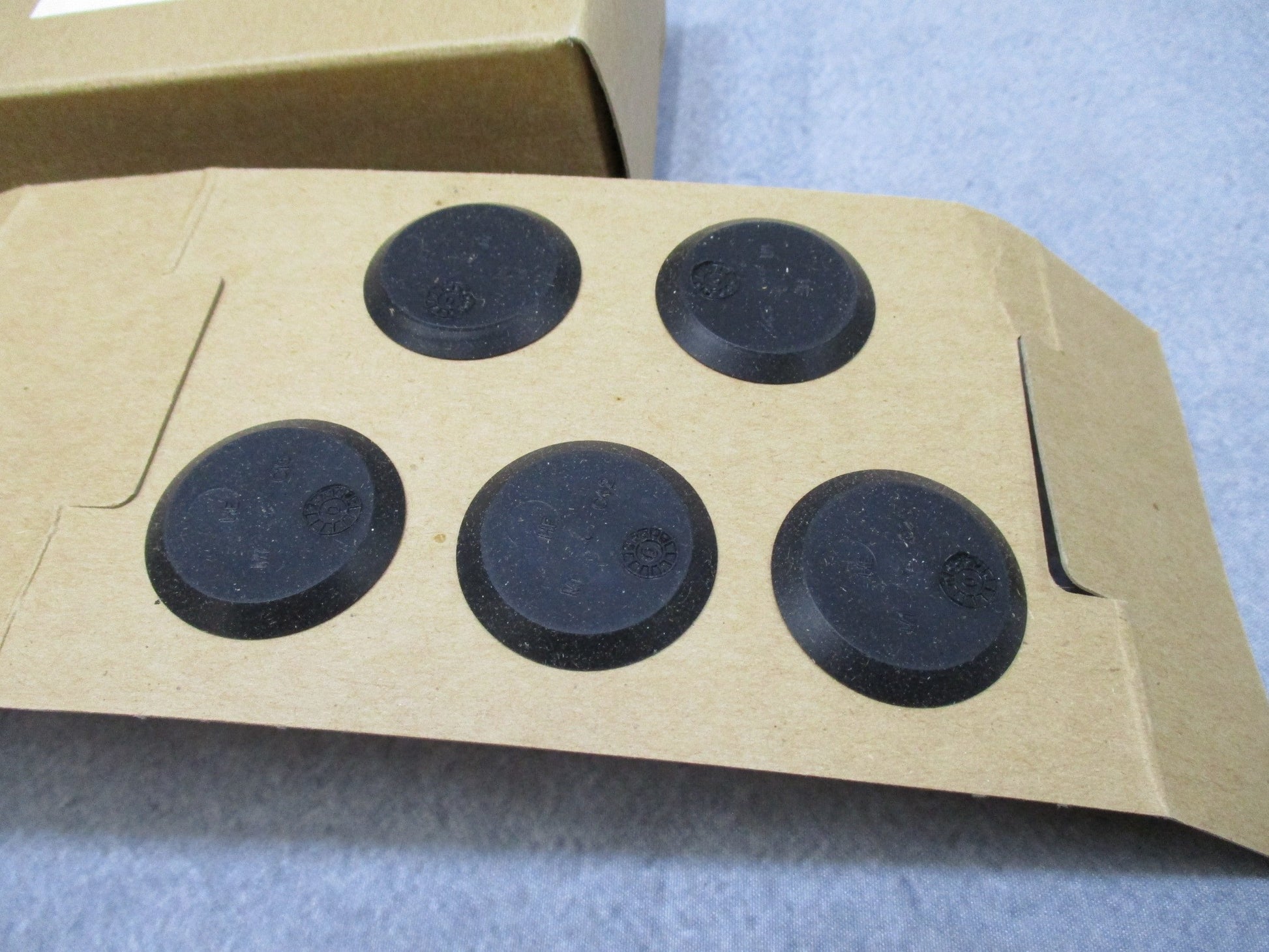 Centex Military Gear USGI M40 gas mask outlet valve disks in a 10 pack, showing the disks' design and features.