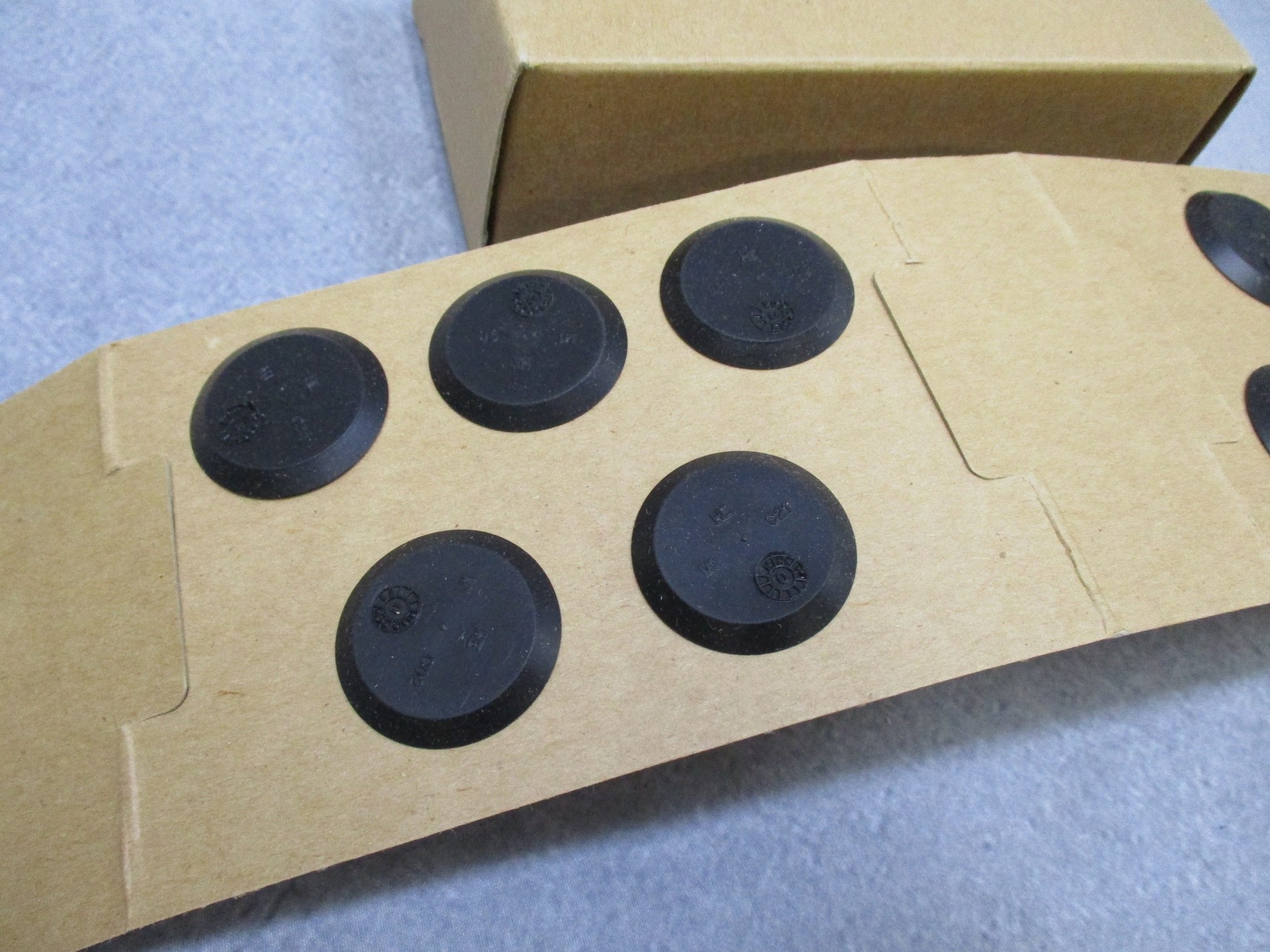 Centex Military Gear USGI M40 gas mask outlet valve disks in a 10 pack, showcasing the MCU-2A/P Millennium valve design.