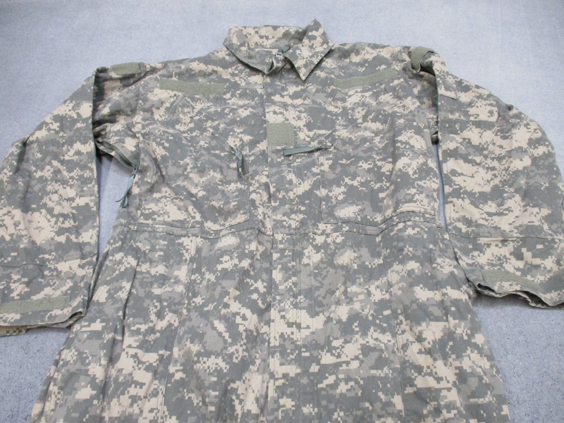 US Army Issue Mechanic Coveralls Type III UCP ACU Digital in X-Large, featuring a camouflage pattern and durable fabric.