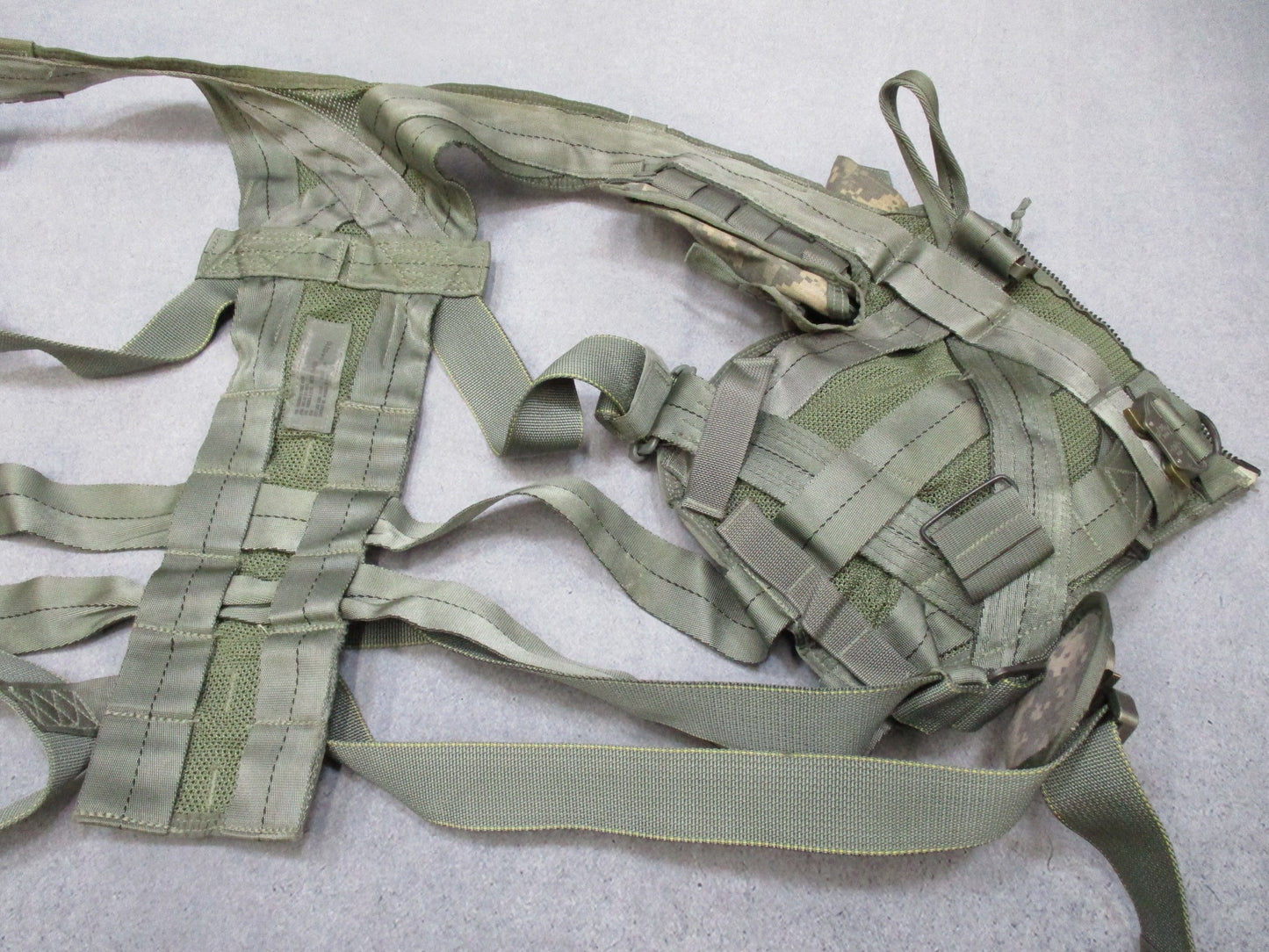 US Army Aviation Air Warrior vest harness by Centex Military Gear, digital aircrew survival extraction harness with straps and pouches.