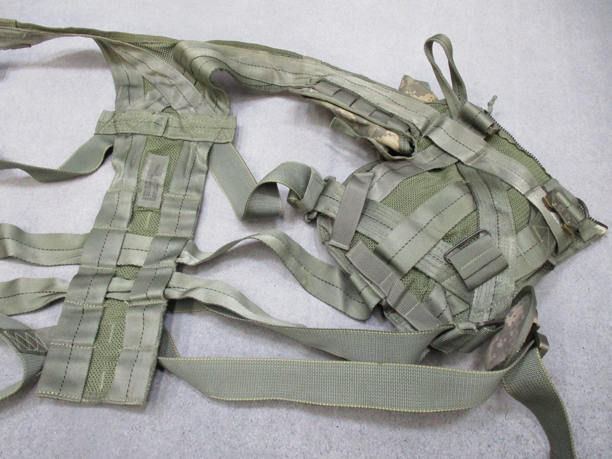 US Army Aviation Air Warrior vest harness by Centex Military Gear, digital aircrew survival extraction harness with straps and pouches.