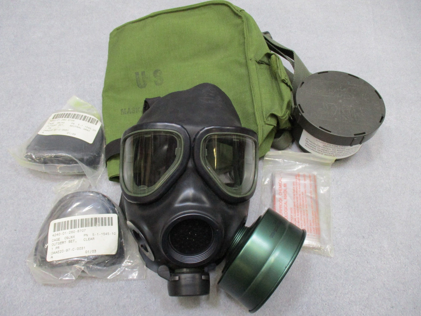 Centex Military Gear M40 gas mask with clear and dark lenses, medium size, includes bag and C2A1 40mm filter for military use.