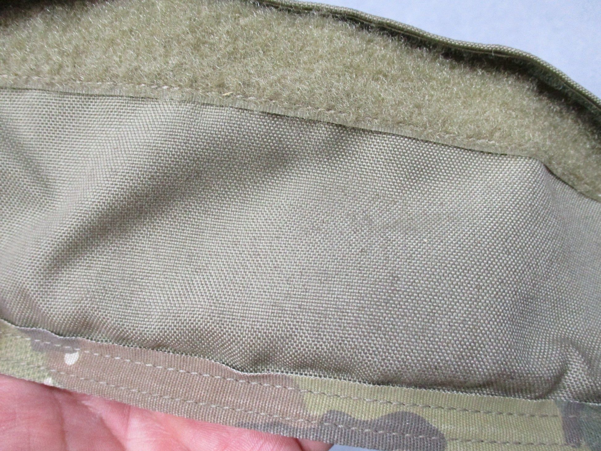 Used Multicam lower back protector butt pad from Centex Military Gear in Army OCP camouflage, showing padded design and camouflage pattern.