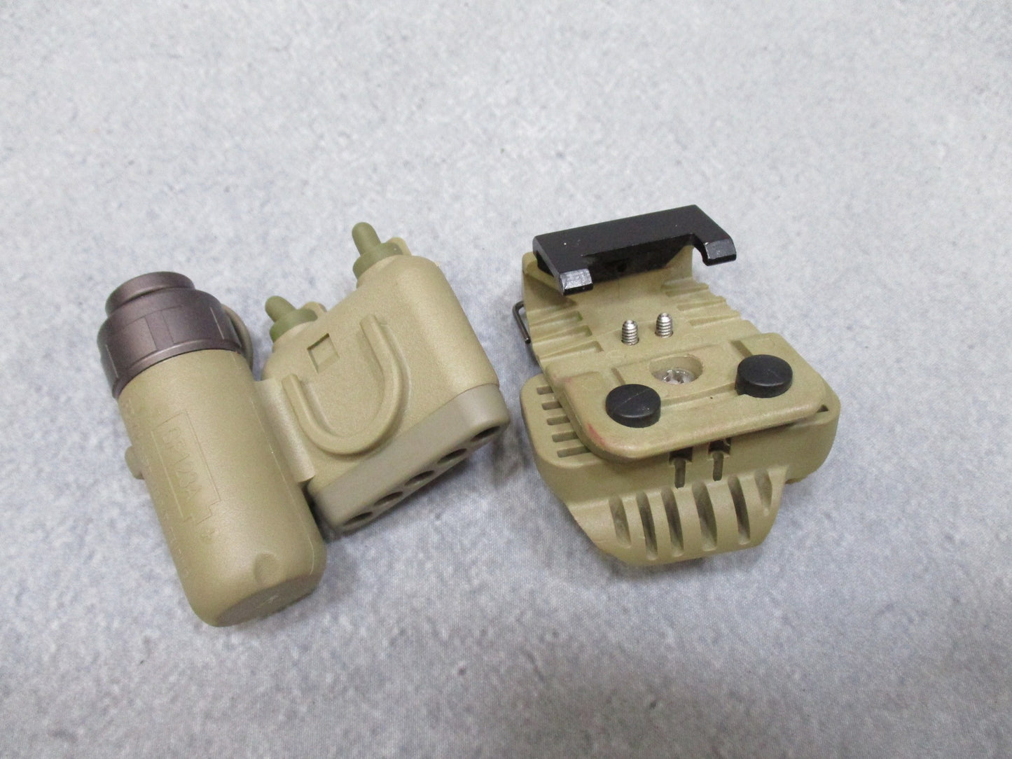 Army tan SureFire helmet light with white and blue LEDs, IR strobe, mounted on ACH/MICH helmet, used by Centex Military Gear.