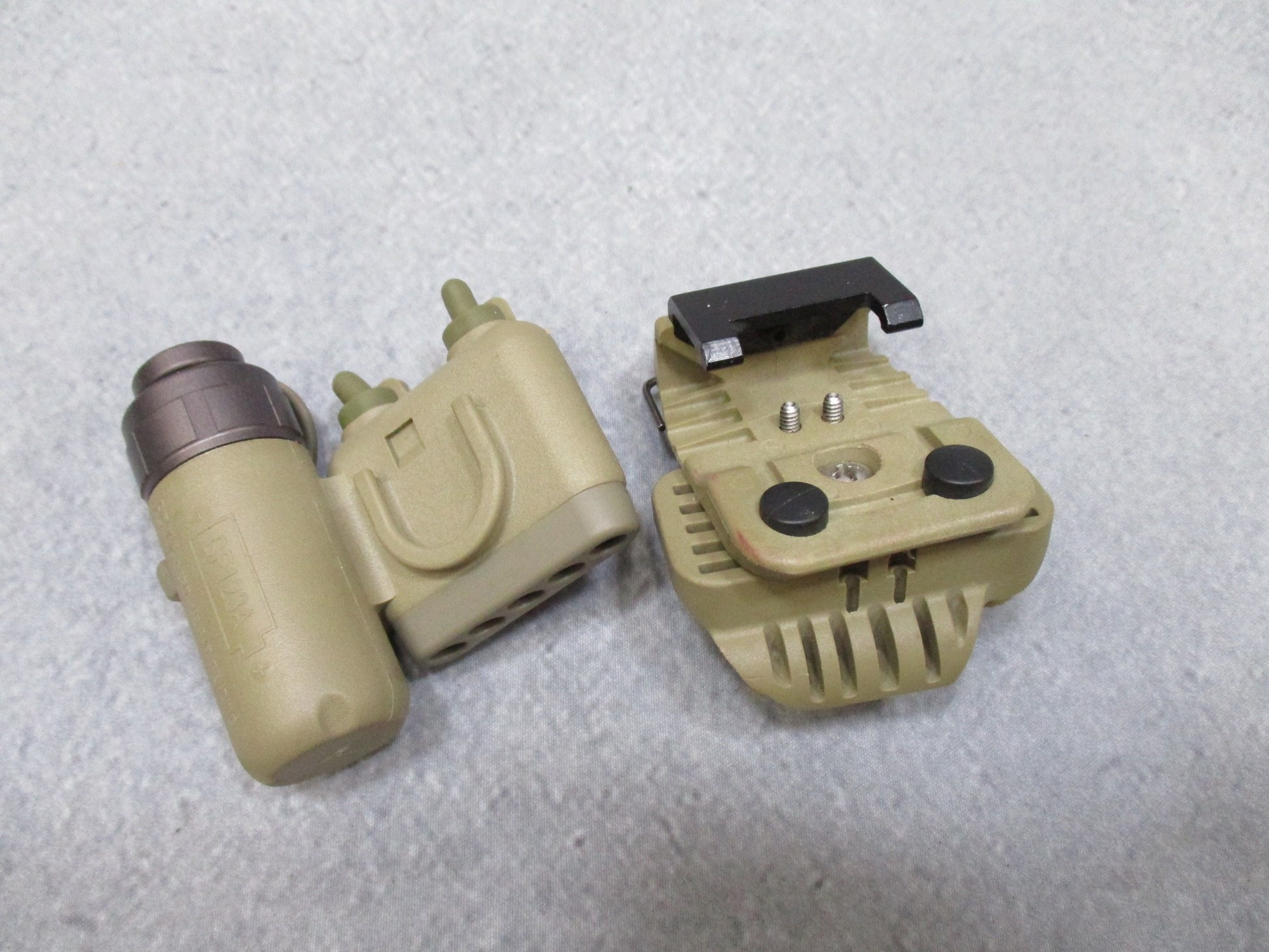 Army tan SureFire helmet light with white and blue LEDs, IR strobe, mounted on ACH/MICH helmet, used by Centex Military Gear.