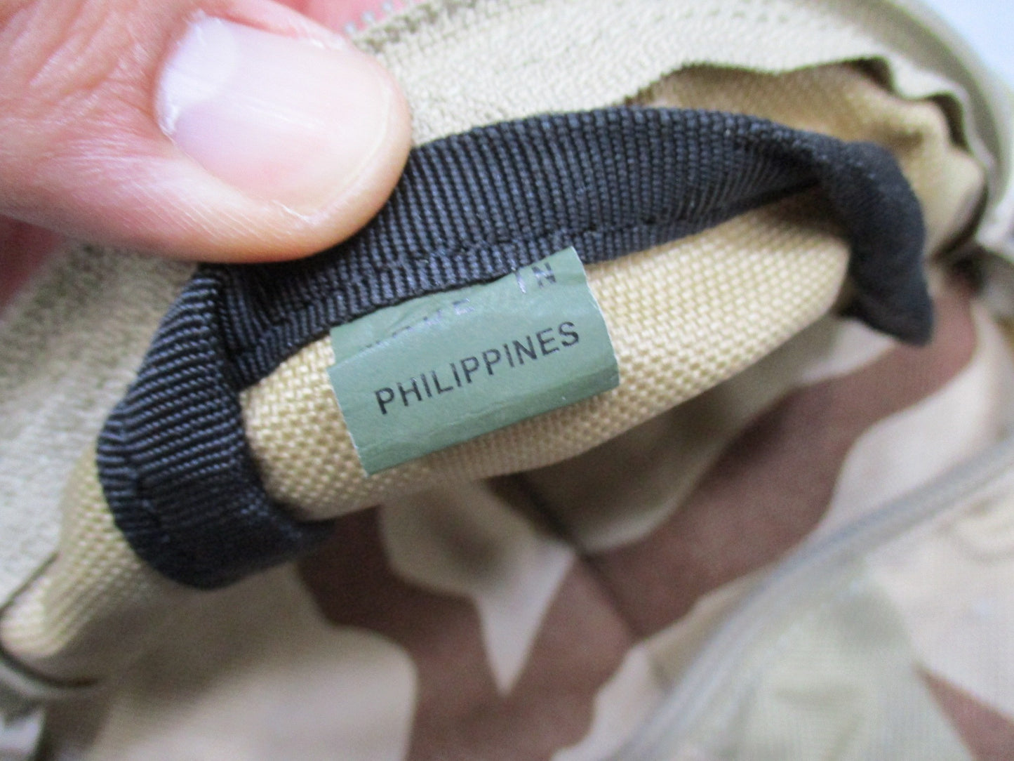 CamelBak MULE hydration pack in desert tan tactical backpack with hydration carrier and multiple compartments, designed for outdoor use.