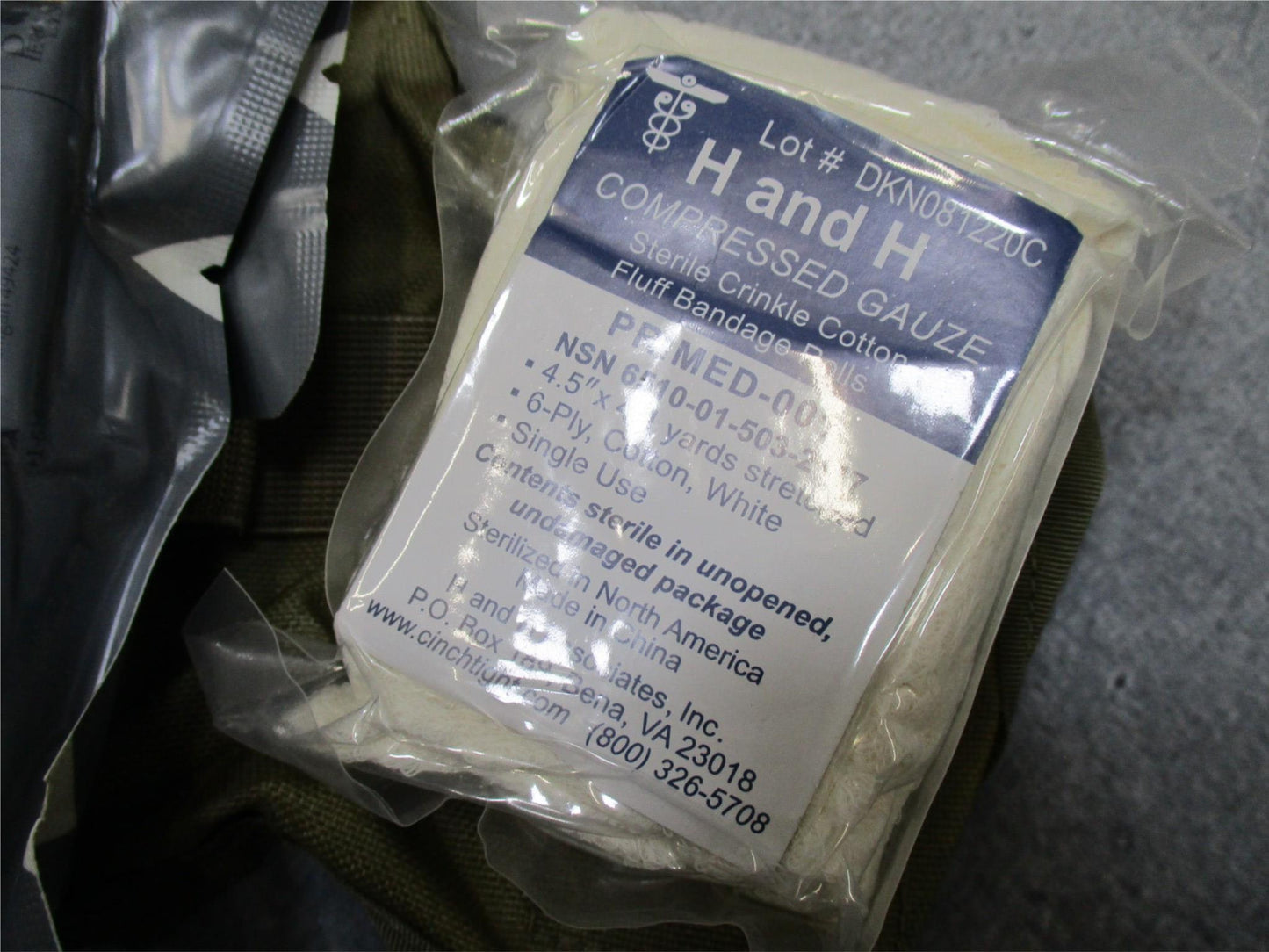 USGI Multicam IFAK pouch with expired medical supplies, military first aid kit by Centex Military Gear, shown in the image.