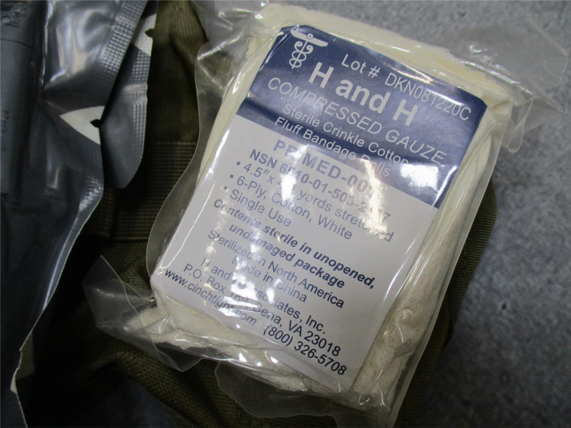 USGI Multicam IFAK pouch with expired medical supplies, military first aid kit by Centex Military Gear, shown in the image.