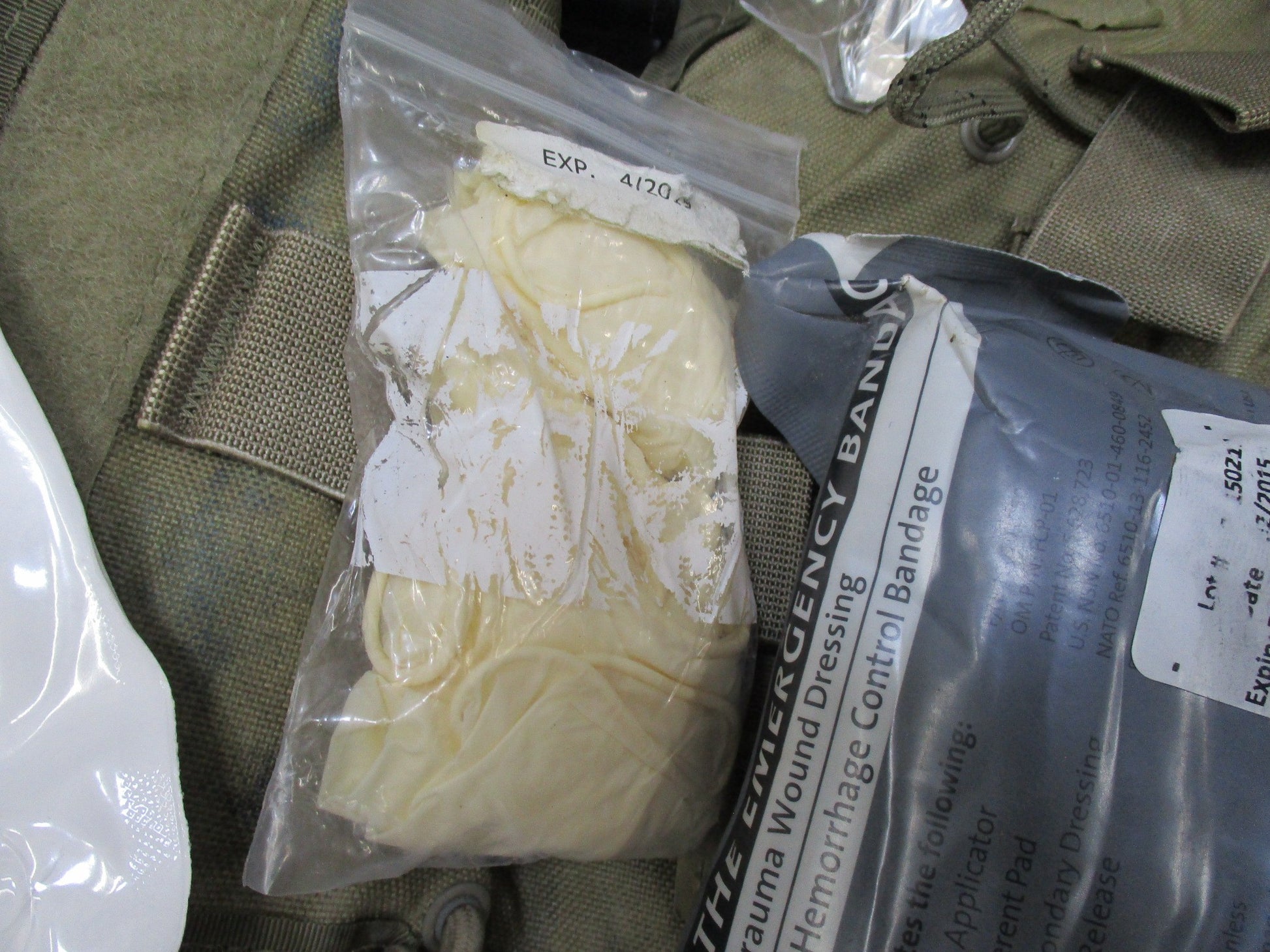 USGI Multicam IFAK pouch with expired medical supplies and military first aid kit, designed by Centex Military Gear