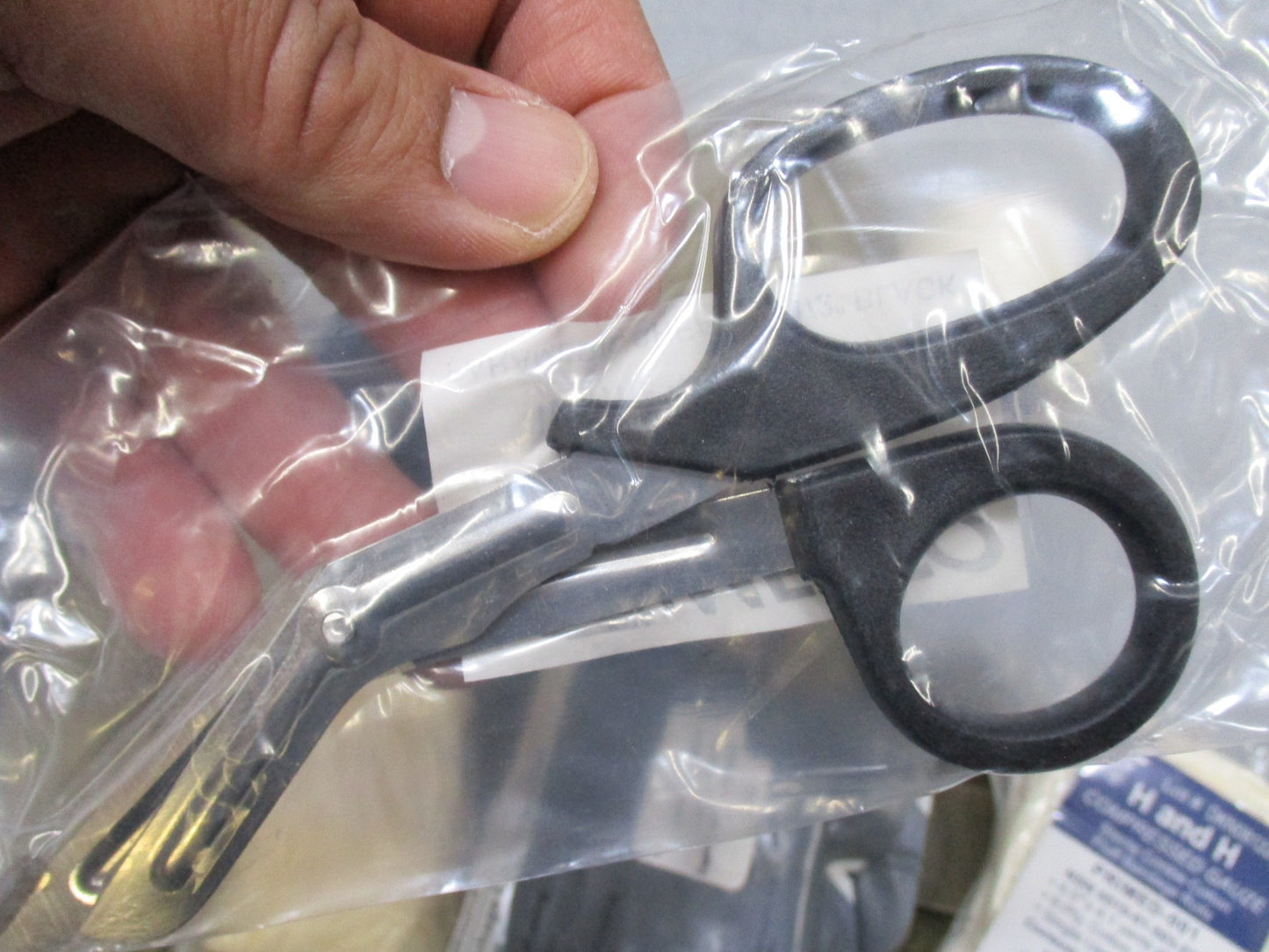 USGI Multicam IFAK pouch with expired medical supplies, military first aid kit by Centex Military Gear on a plain background