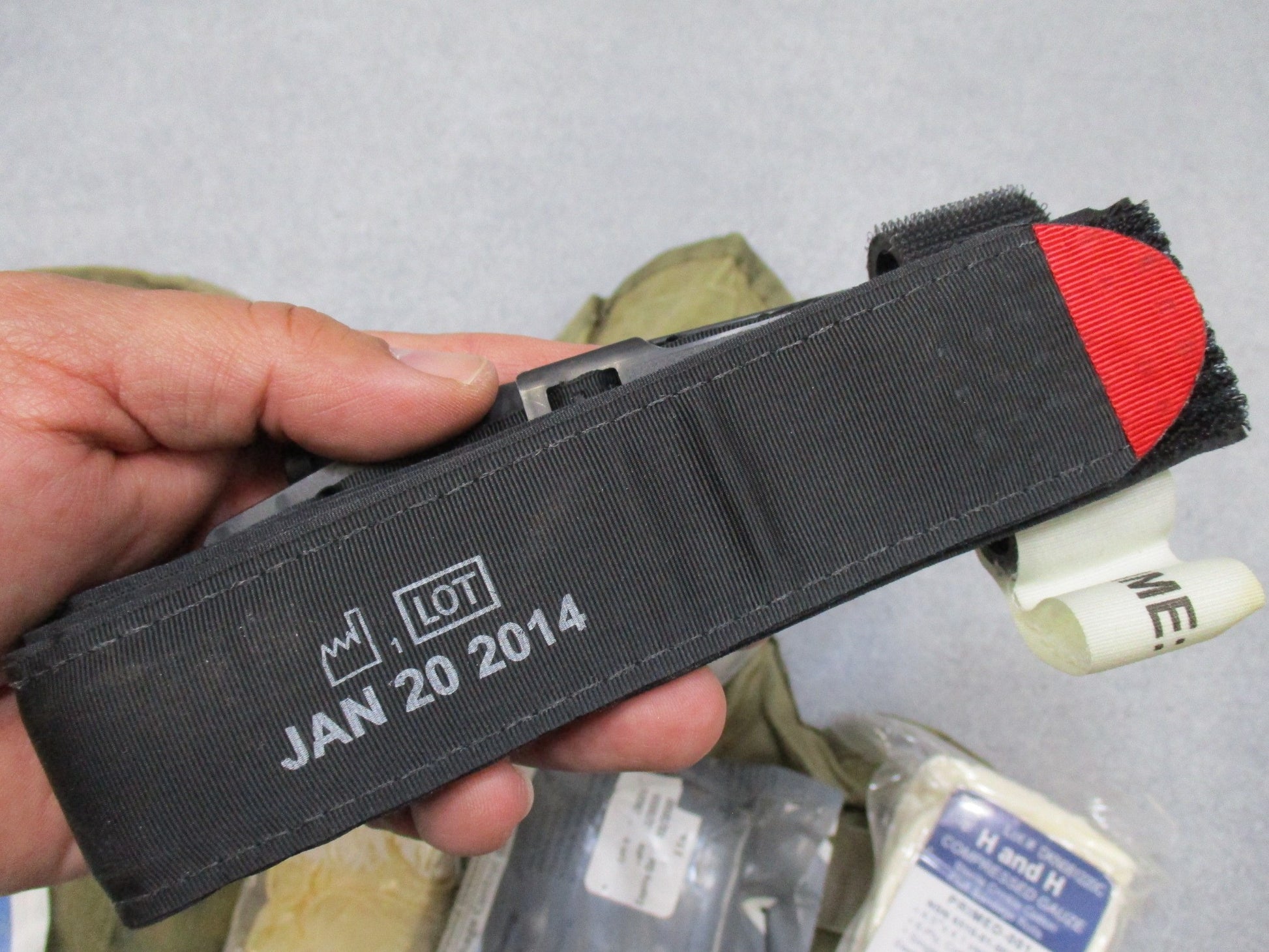 USGI Multicam IFAK pouch with expired medical supplies, military first aid kit by Centex Military Gear, designed for tactical use