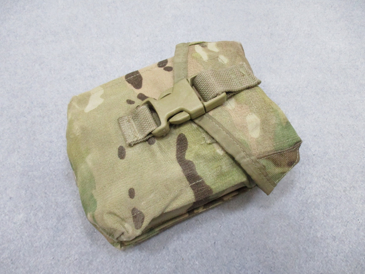 USGI Multicam IFAK pouch with expired medical contents, military first aid kit by Centex Military Gear, outdoor medical emergency supplies